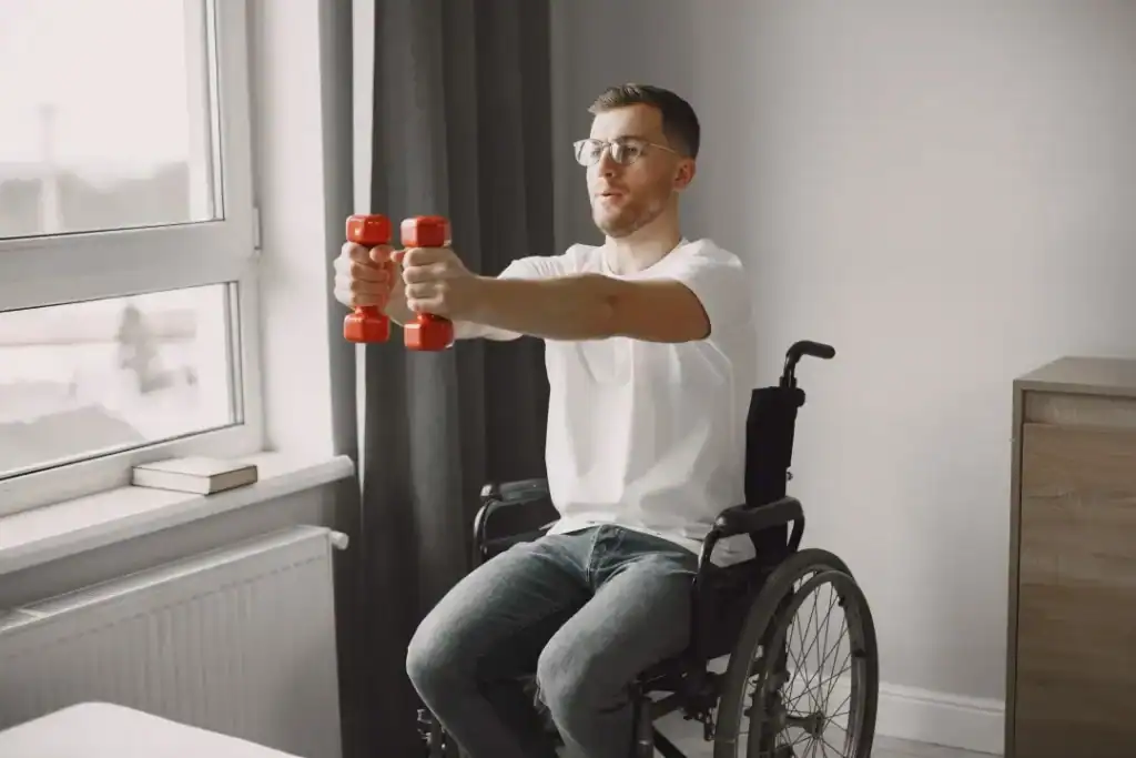 Image of man doing exercise in his wheelchair to aid weight loss Doancaster