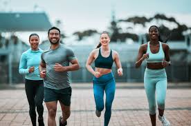 Sculpting Sleek Arms: The Essential Role of Cardio in Toning Without Bulking Up 3 image of people running to incorporate cardio Doancaster exercise into their life to help tone arms and body.