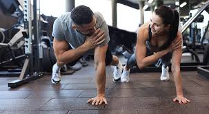Image of man and woman doing Cardio Doancaster to tone their arms. 